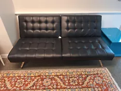 Convertible Sofa Bed Faux Leather/Linen Futon Couch. It is used and in ok condition. has tiny punctures from cat at...