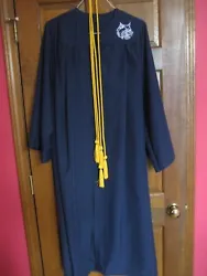 The gown has an embroidered Wildcat Head on the left side.