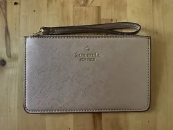 KATE SPADE PINK SHIMMER WRISTLET. Used for one weekend, wasnt my style. Basically brand new. Super pretty glitter pink...