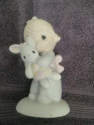 This Precious Moments figurine depicts Jonathan & David holding a cute Easter Bunny while a little girl hugs Jesus....