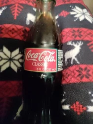 Full bottle 1996 Coke Christmas. I have 3 of these if you want all 3 we can make a deal. This auction is for 1 bottle...