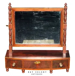 This wonderful shaving mirror stands on 6 turned ball feet and is fitted with 3 base drawers & a large rectangular...