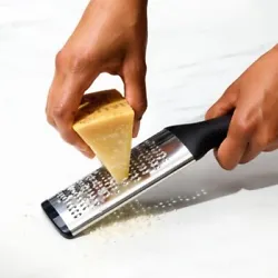 The Grater features a stainless steel head that yields finely grated citrus zest, chocolate, hard cheeses, and more....