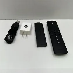 This Amazon Fire Stick 4K 1st Gen Model E9L29Y comes with a remote and power adapter. It has Wi-Fi, HDMI, and USB port...