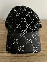 Gucci hat. Velvet black, metallic silver GG motif,Velcro adjustable strap, size medium excellent condition, no signs of...