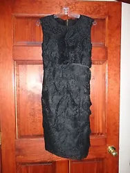 Beautiful gown! Never worn! Great black lace. No stains or tears.approx 39