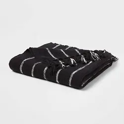 •Oversized woven throw blanket •Adorned with white stripes on a black backdrop •Fringed ends •100% midweight...