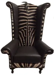 AFRICAN BURCHELL ZEBRA HIDE WINGBACK CHAIR. The chair features genuine, spectacular Zebra hide with mane detail and top...