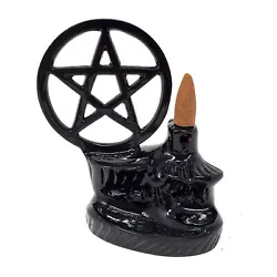 A backflow style incense burner, made from a solid metal with a shiny black finish. Place a backflow cone on ledge and...