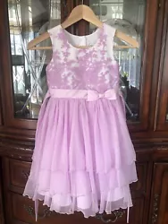 Jona Michelle girls dress, size 6. Flawless condition with no issues. Four buttons and ribbon tie on the back.Measures...