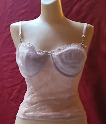 This sheer elegent pastel pink bustier is semi padded with some added bling large rinstones on each of the spaghetti ...
