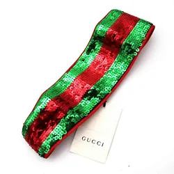 Green & red sequin stripe headband. Red silk lining. Lining: 100% silk. Elastic stretch back inset. Elastic inset: 3...