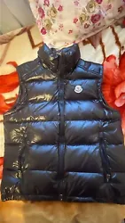 This Moncler vest is a must-have for any stylish mans wardrobe. The brand is known for its high-quality products,...