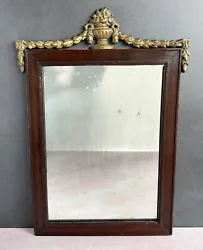 This listing is for a mid-1850s Neoclassical Empire/Federal wall mirror. The original silvered mirror is framed in a...