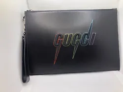 Gucci wristlet clutch is the perfect accessory to complete any outfit. There is a detachable wristlet strap and a...