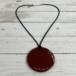 This stunning necklace by Tiffany & Co. features a disc-shaped pendant made of Japanese hardwood lacquer in a beautiful...