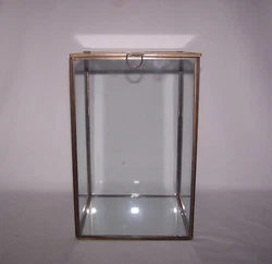 Its all glass and brass. Glass Display Case . The door on top opens.