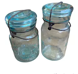 antique vtg Lightning jars Putnam 7 & 87 Glass Canning Farmhouse. Aqua glass with bubbles!Condition: one bail is rusted...