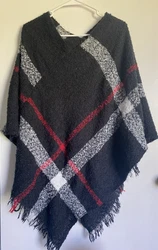 Get cozy this winter with the Ana & Kate Poncho Cardigan. Made for women in one size, this stylish black cardigan is...