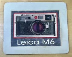 This Leica M6 Silver Mouse Pad is used but in good condition.  The face is a bit stained, but not very worn.  It may...
