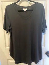 Rayon polyester spandex. Solid black. V-neck, short sleeves, slight hi low hem. Preowned in excellent condition.