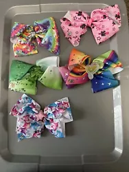 Lot of five preowned bows. Note bow with medallion detaching. Sold as is. Item 228