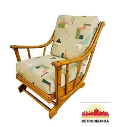 This listing is for a vintage Rattan Lounge Chair. Featuring a curved rattan arm design, original removable cushions,...