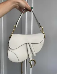 Elevate your style with this designer Christian Dior saddle bag in pristine white calfskin leather. Crafted with care...