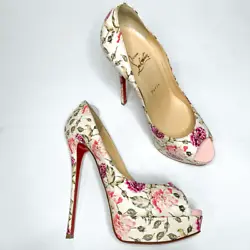 Peep almond toe with contrasting pink patent leather. Ivory snakeskin-textured leather upper with a romantic multicolor...