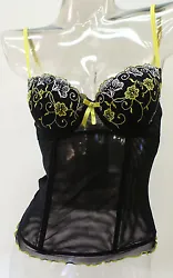 Hook-and-eye closure in the back complete the bustier. Embroidered Wild Flower accents. Color: Black. Condition: New...