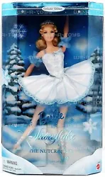 Glittering snowflakes decorate her bodice while sheer, iridescent tights and delicate blue toe shoes complete her...