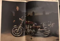 This vintage print ad features a stunning image of a woman standing next to a 1979 Honda Motorcycle - a true...