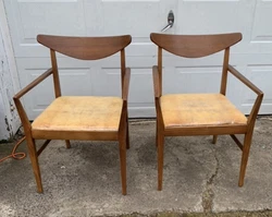 MCM Stanley can I dining arm chairs. You will see a little damage on the last picture that is on each side of each...