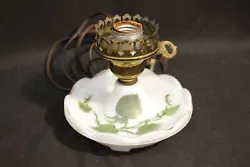 Dish type base with hand painted ivy inside and faint gold leaf around edges. Ornate key design turn switch.