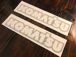 This is a listing for a set of 2 dual layer Kumatsu Stickers These stickers are in the color: gloss Black background...