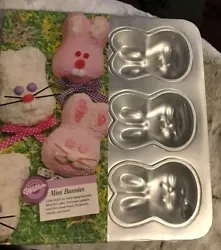 Retired pan ....Each bunny head is 4.5” long.total pan size is 12x13.Wilton Mini Bunny cake pan...