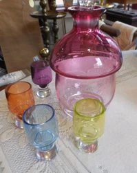 Rose Glass Decantor with 4 Color Glass Cups all in good condition. Decanter measures 6 1/2