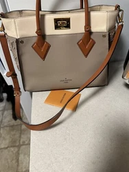 Used only a couple times. Very good condition. This Louis Vuitton tote bag features the iconic Monogram Tuffetage...