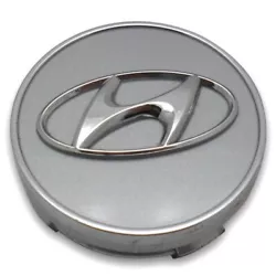 One OEM Hyundai Center Cap. The cap is used and has minor surface blemishes from normal use.