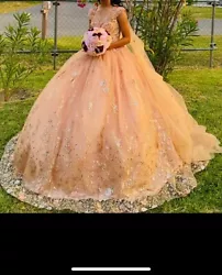 quinceanera dress rose gold. Only used once like new. Actual picture of my daughter wearing the dress