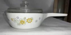 Corning Ware One pint sauce pan floral yellow spring cover. Has cover,not positive if original cover but fits ,has...