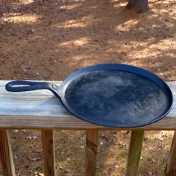 It has a raised number 8 on the top end of the handle and the bottom has a solid heat ring with an approx. 3