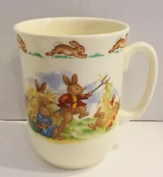 The top of the mugs has a border of hopping bunnies all around the mug.
