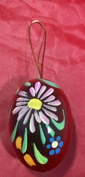 The egg shape, in festive red color, makes it an ideal addition to your Christmas or Easter collection.