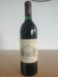 MÉDOC 1988 - Château HAUTE GRILLE - Vin De Bordeaux. Capsule et bouchon en bon état Étiquette légèrement tachée...