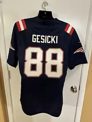 The jersey resembles what Mike Gesicki wears out on the field and is distinguished by the trademark New England...
