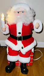 Santa is sitting on a cardboard chimney. Moves his arms and legs. Chimney box length 9