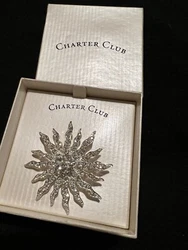 Goregeous, new in original box snowflake brooch.