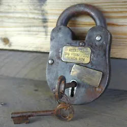Heavy duty cast iron lock with a rusted antique finish. Historical reproduction of a federal prison lock.