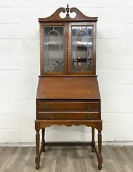 This is a beautiful vintage drop front secretary desk with hutch or bureau bookcase, with elements of Jacobean and...